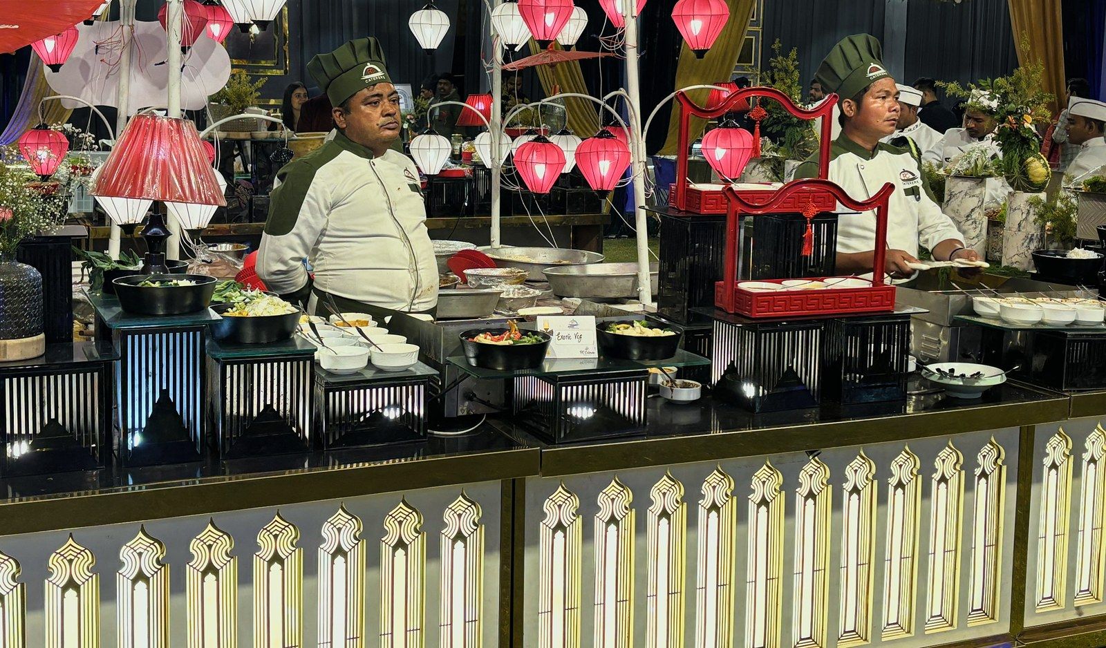 Chefs at the Tokyo live station, under pink paper lanterns
