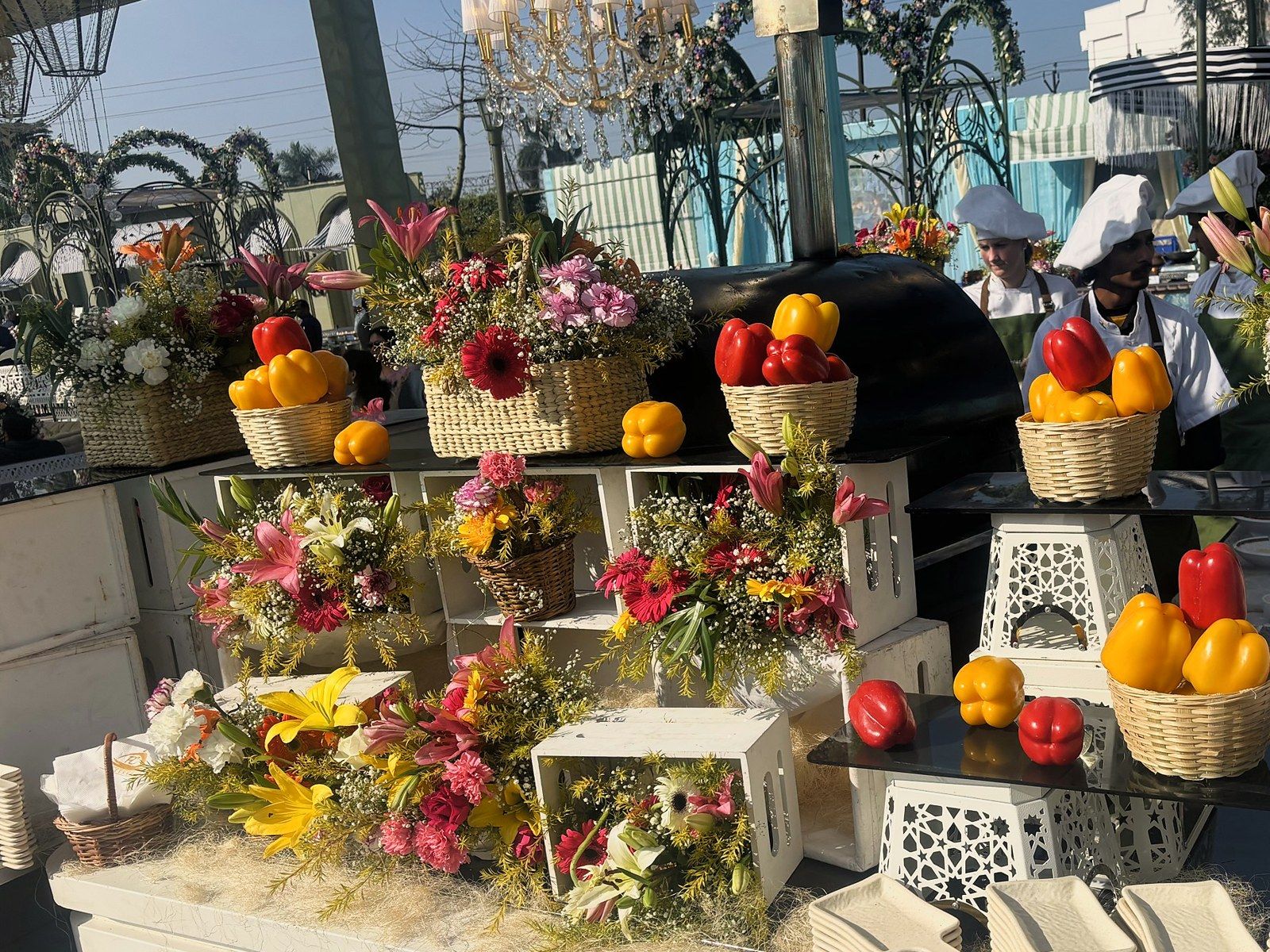 A live counter dressed with peppers and flowers