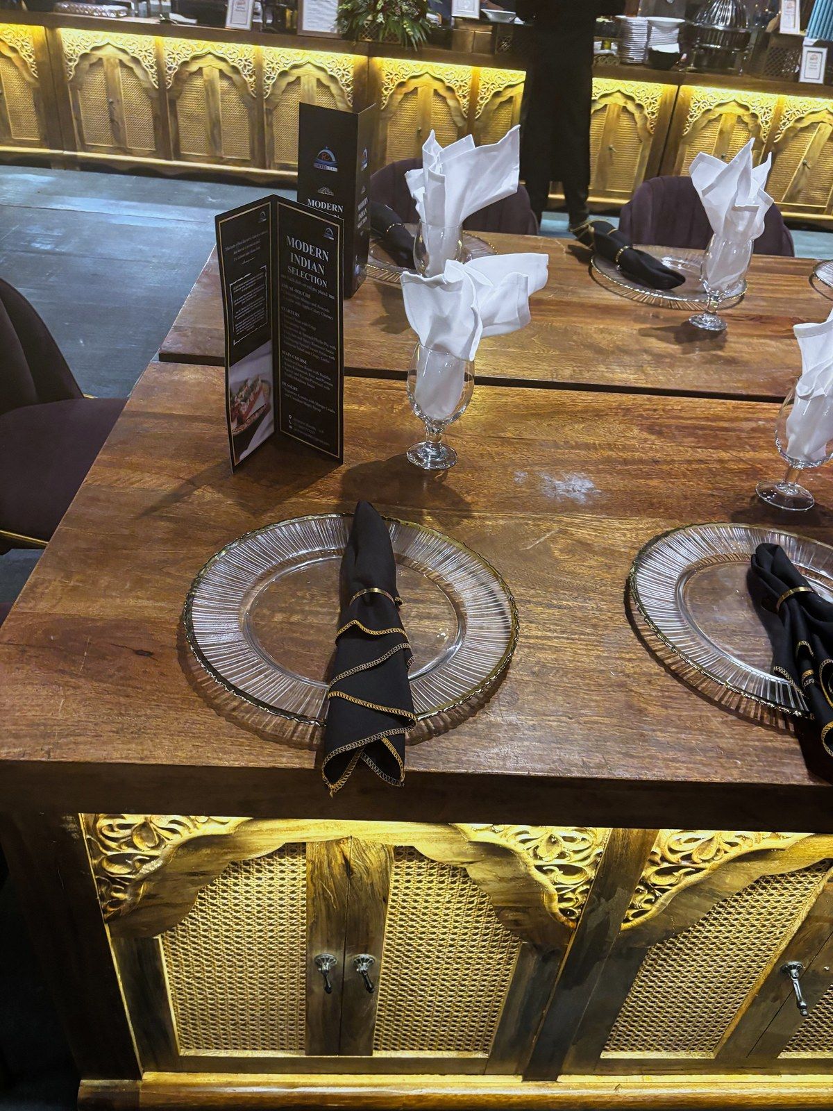 Wooden table set with a printed menu card