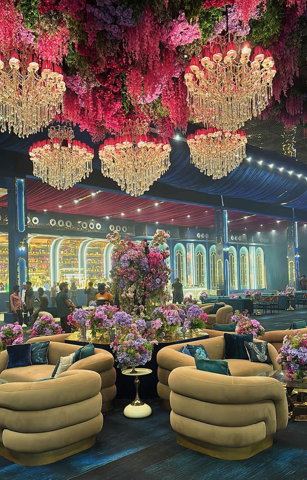 Lounge under a pink floral ceiling and chandeliers